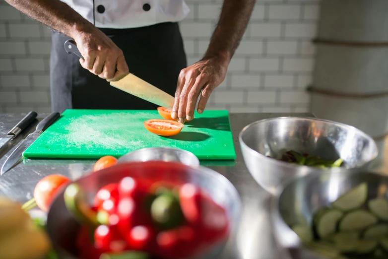 the man is preparing the dishes for his upcoming meal