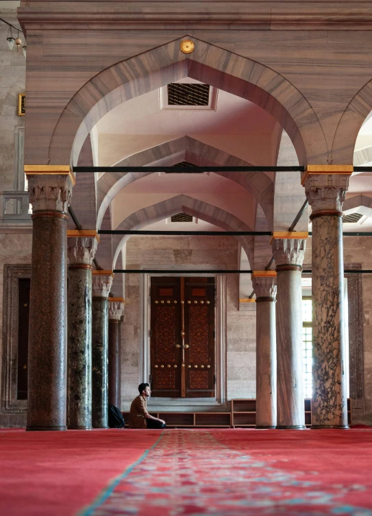 the inside of a mosque that is pink