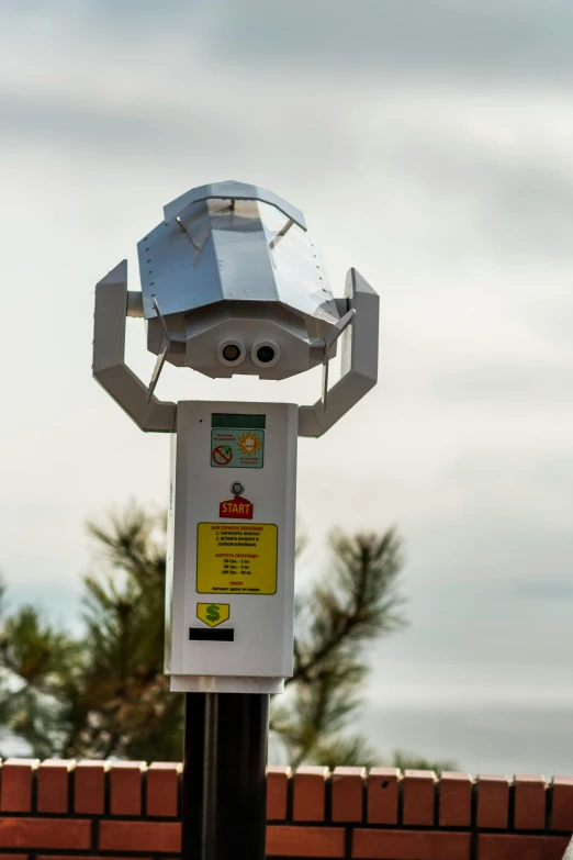 a street light with a futuristic decoration on it's top