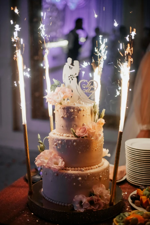 a fancy cake with many sparklers on top