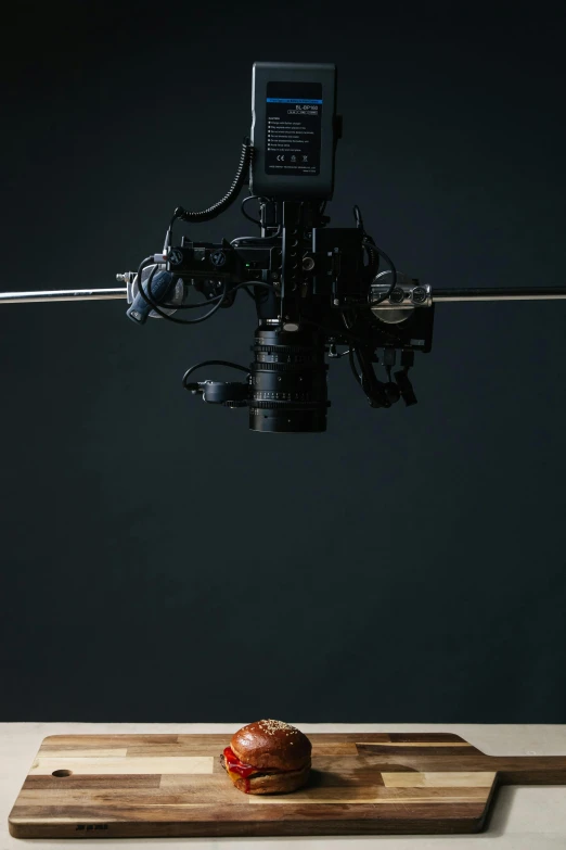 a camera is mounted to the side of a wooden tray