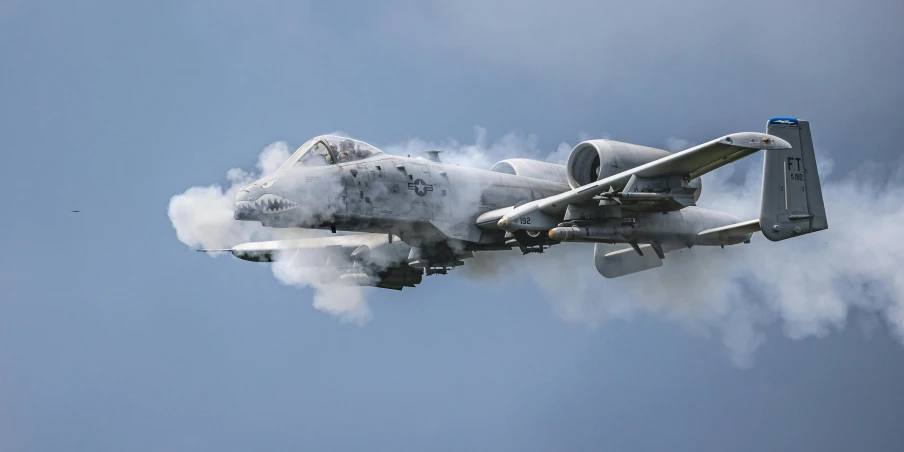 a propeller jet is shown with the smoke coming out of it