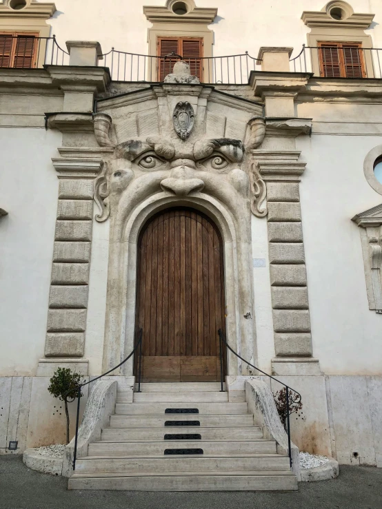 a very large doorway near steps and stairs