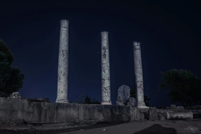 an image of columns and stars lit up in the night