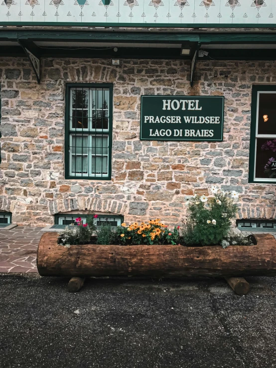 the sign outside of the el shows a log for storing flowers