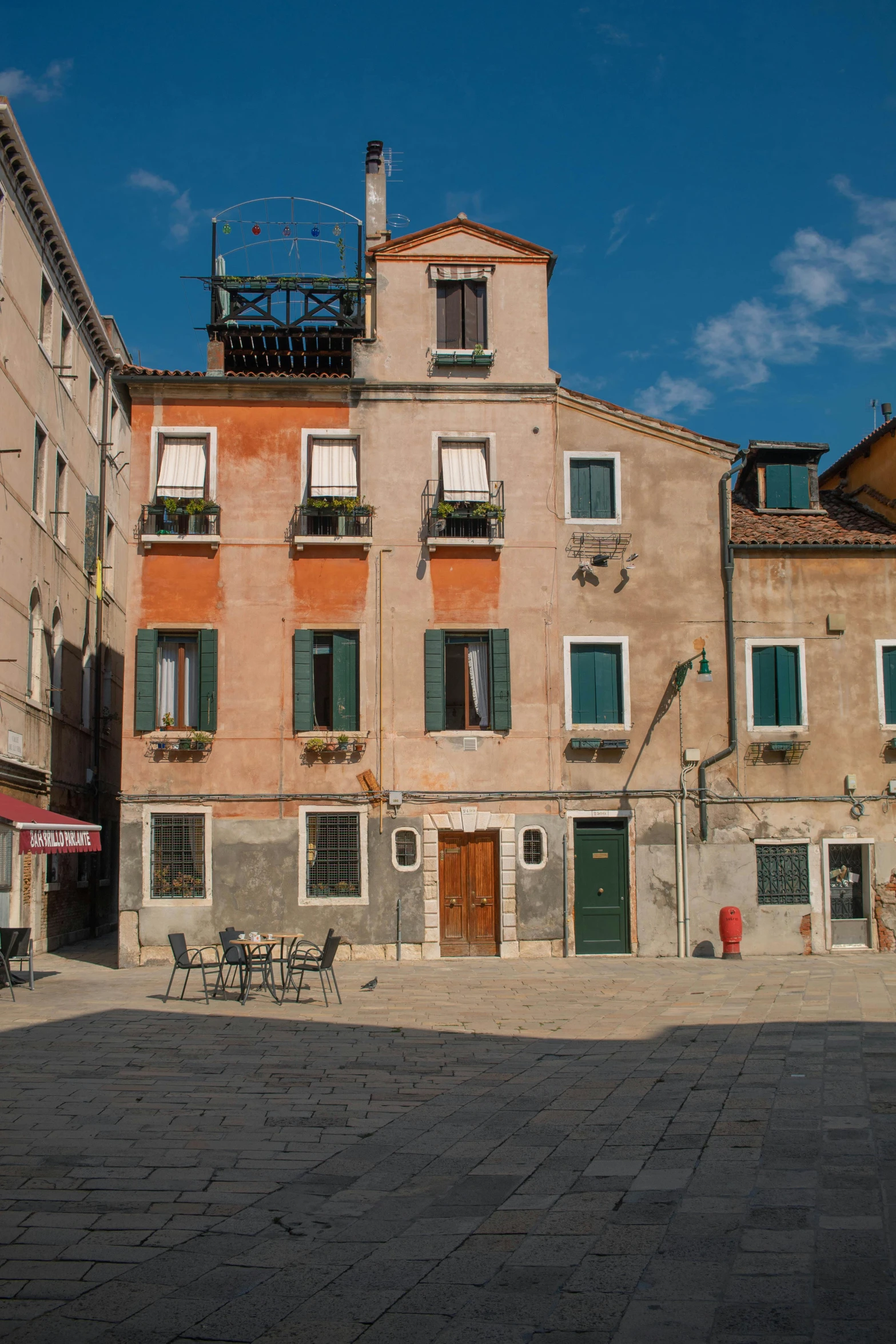 an old building in an open square on a sunny day