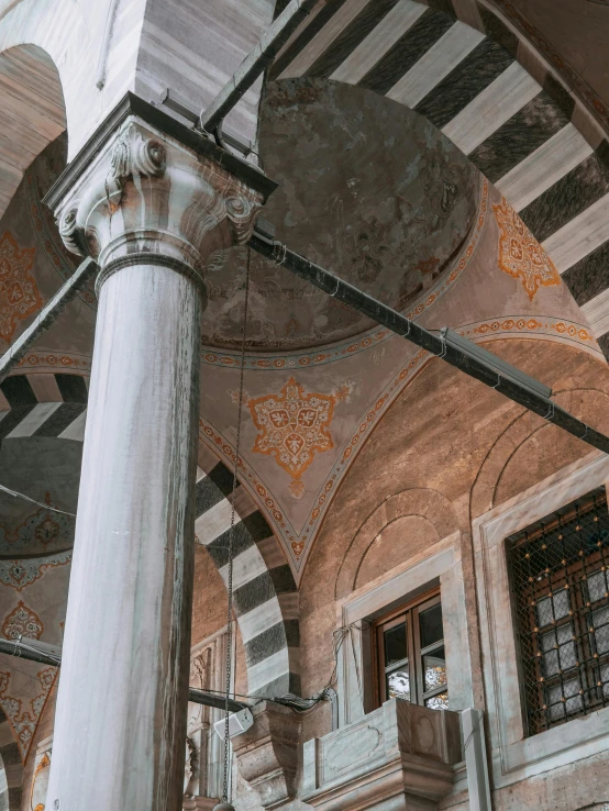 a large white building with intricate designs and pillars