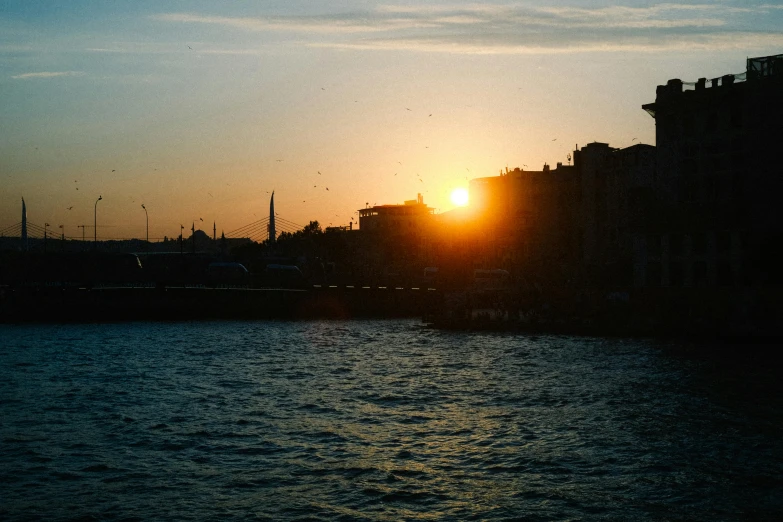 a large body of water with a city in the background