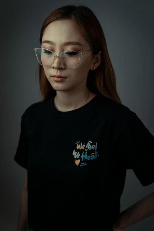 woman wearing glasses and smiling at camera