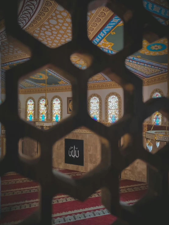 the interior of an ornate building with decorative architecture