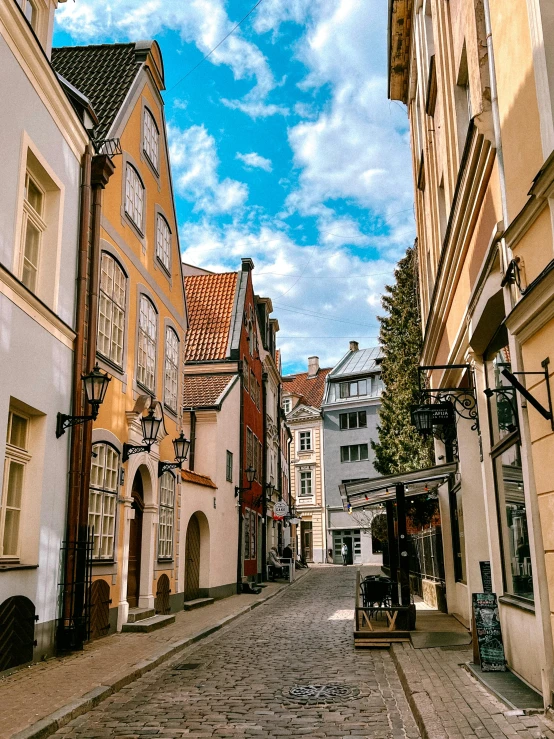 an alley way between several old buildings