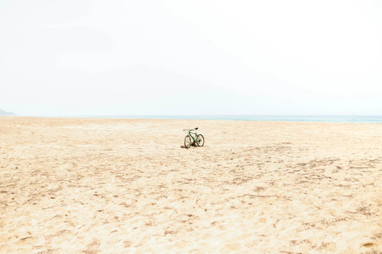 bike parked on beach, just after sunset