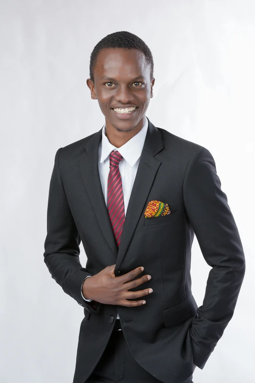 a man posing for a portrait in a suit