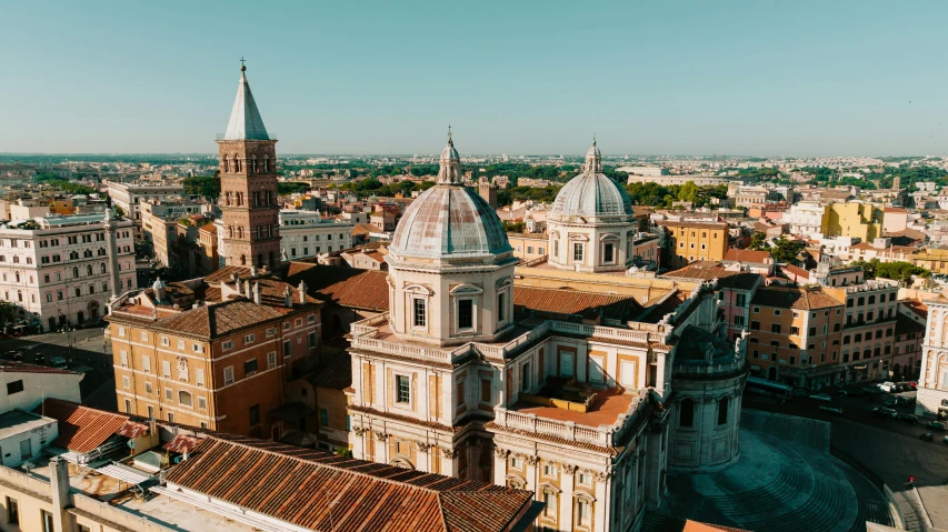 a view of a city with the old buildings and rooftops