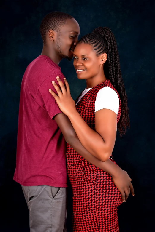 a woman in a red and white dress hugging her boyfriend