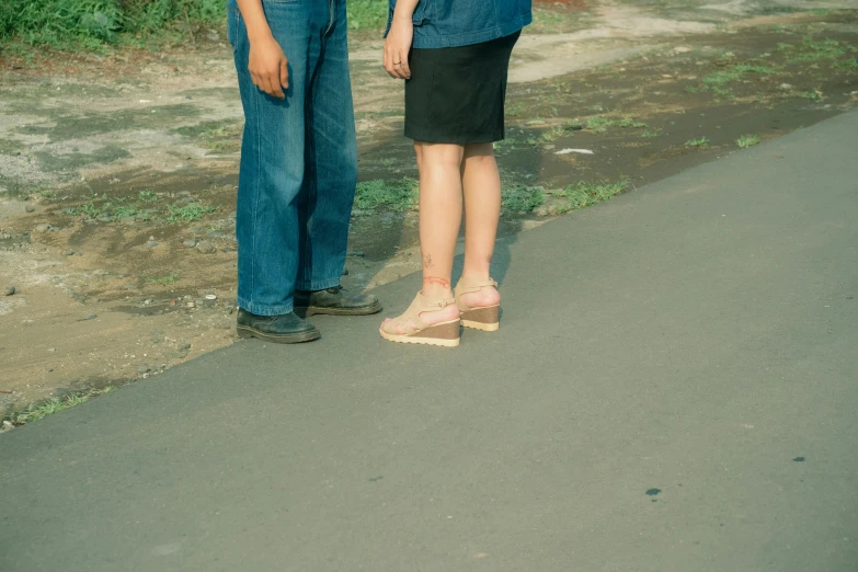 there are two people standing on the street together