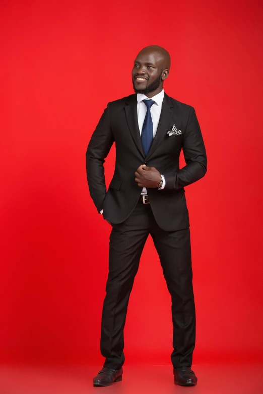 an african american man in a black suit and tie