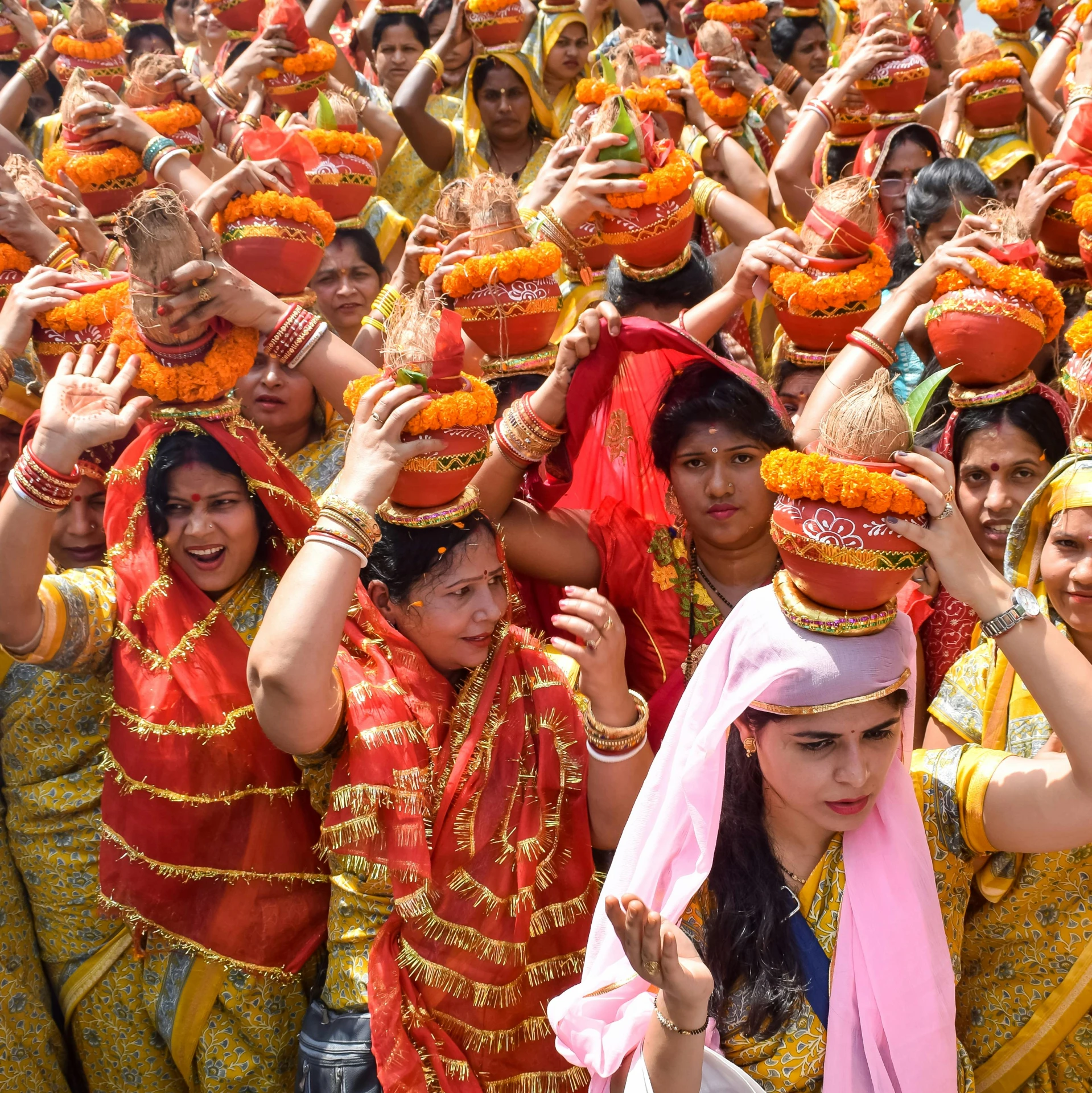 a group of women in indian dress with colorful costumes