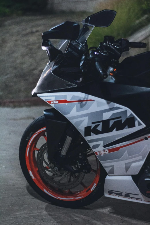 this motorcycle is painted grey with red accents