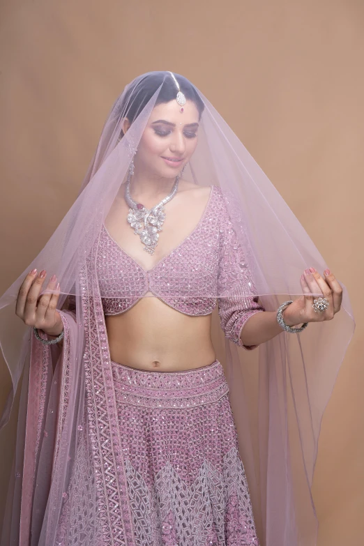 a woman in purple bridal with a veil over her head
