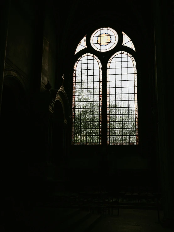 an empty doorway and stained glass window inside of an building