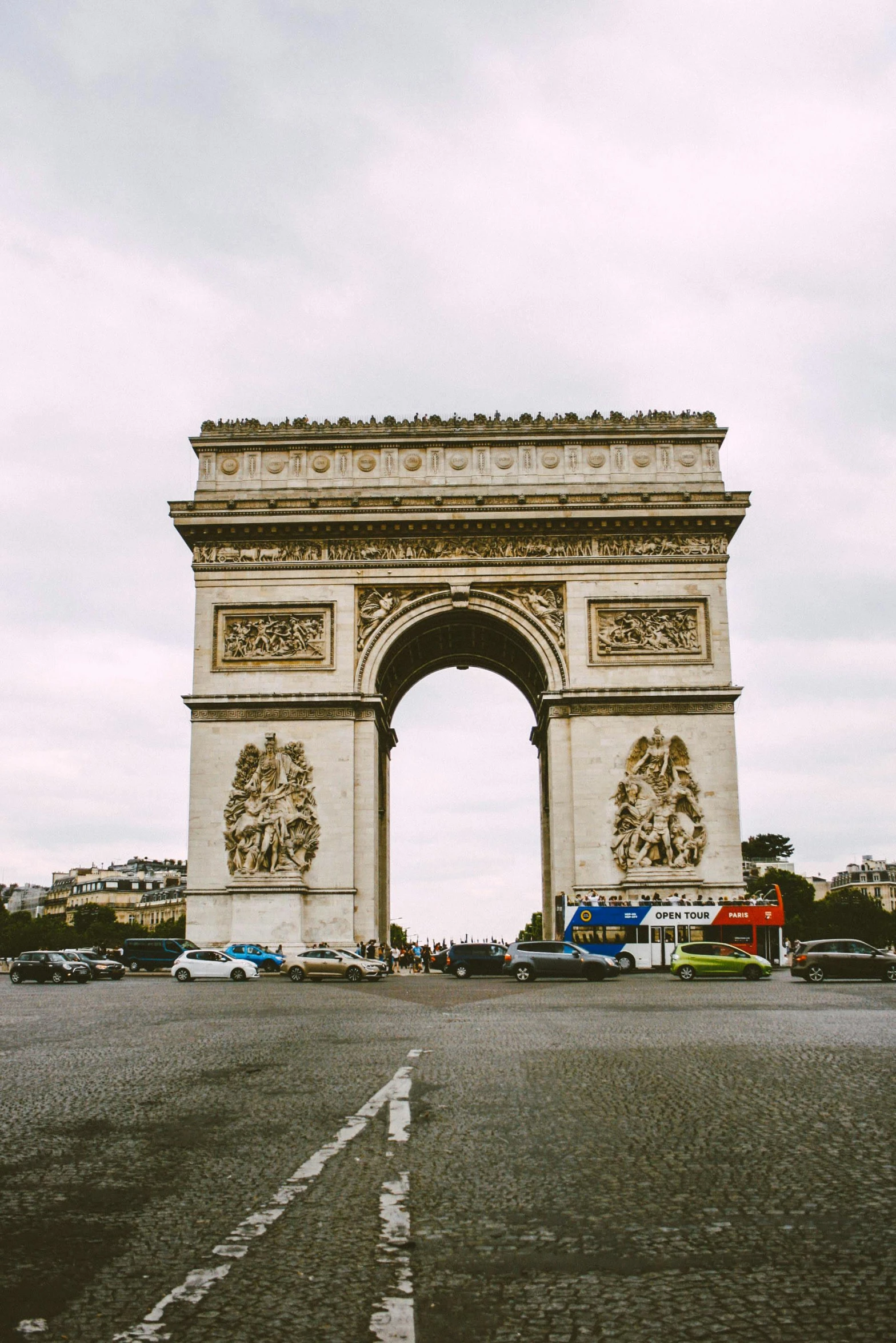 an arch that is next to a lot with cars