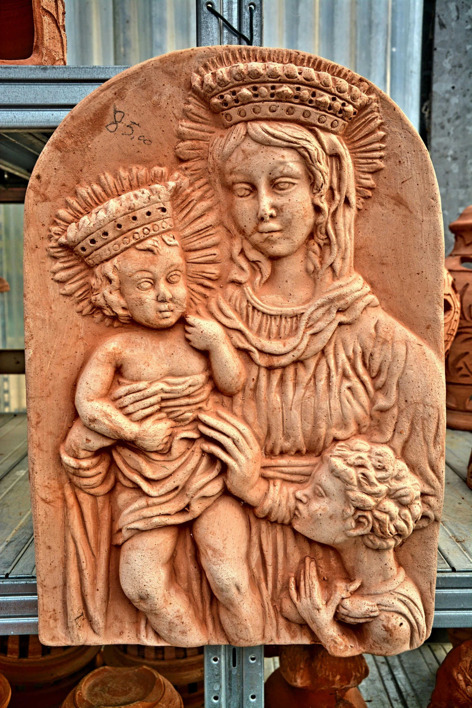 sculpture of woman with child in terracotta