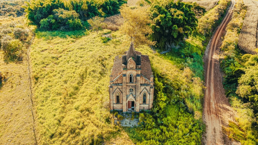 an old church sits among the tall trees