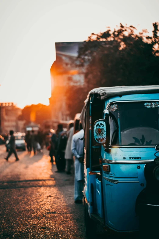 a blue car is parked on the side of a street