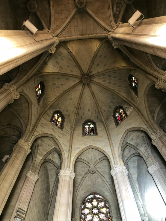 some colorful windows on the ceiling and inside of a building