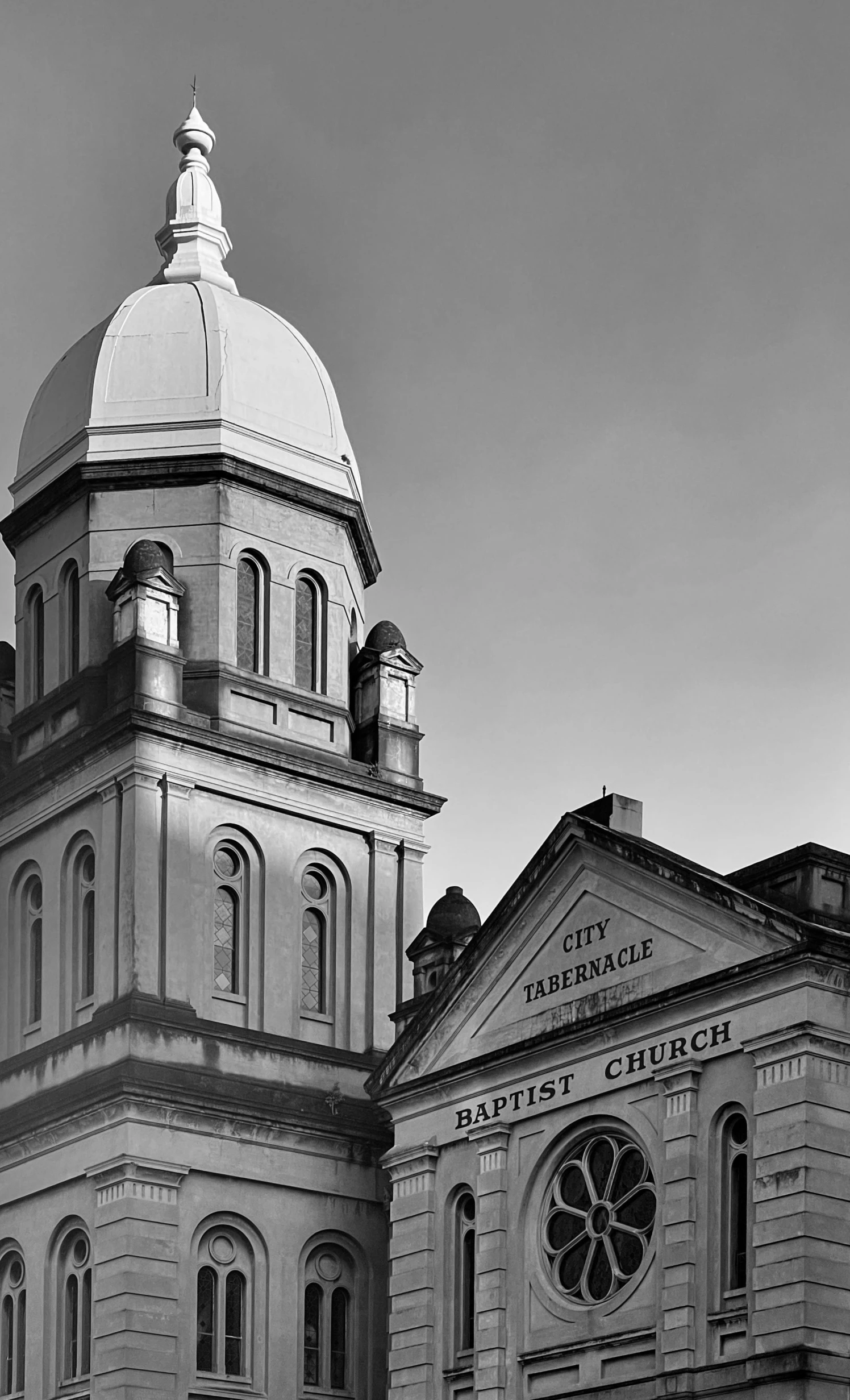 a view of two different buildings and a bell tower