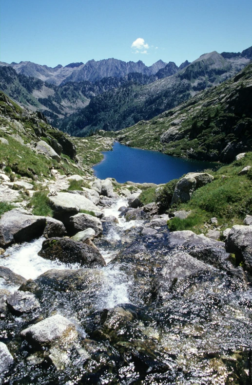 the mountains are covered in thick rock with water running on them