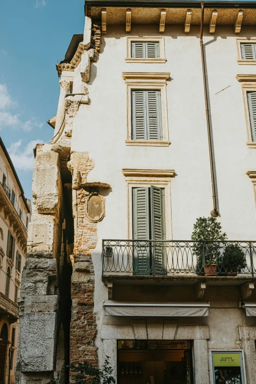 the facade of an old building with balconies on it