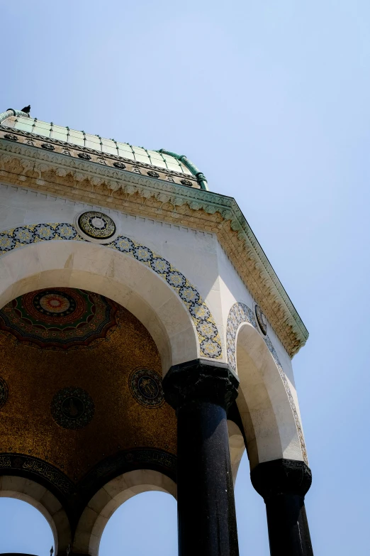 a very tall clock tower with an ornate design