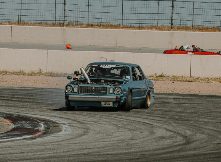 a car driving through an obstacle course on a road