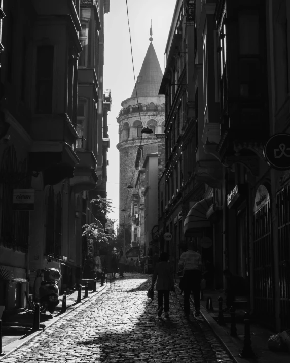 black and white pograph of a narrow cobblestone road