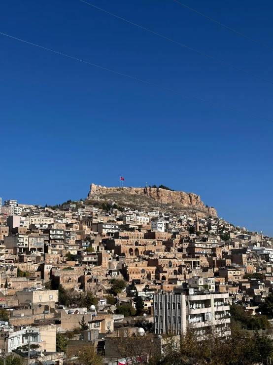 a large city with lots of electrical lines and houses on top of it