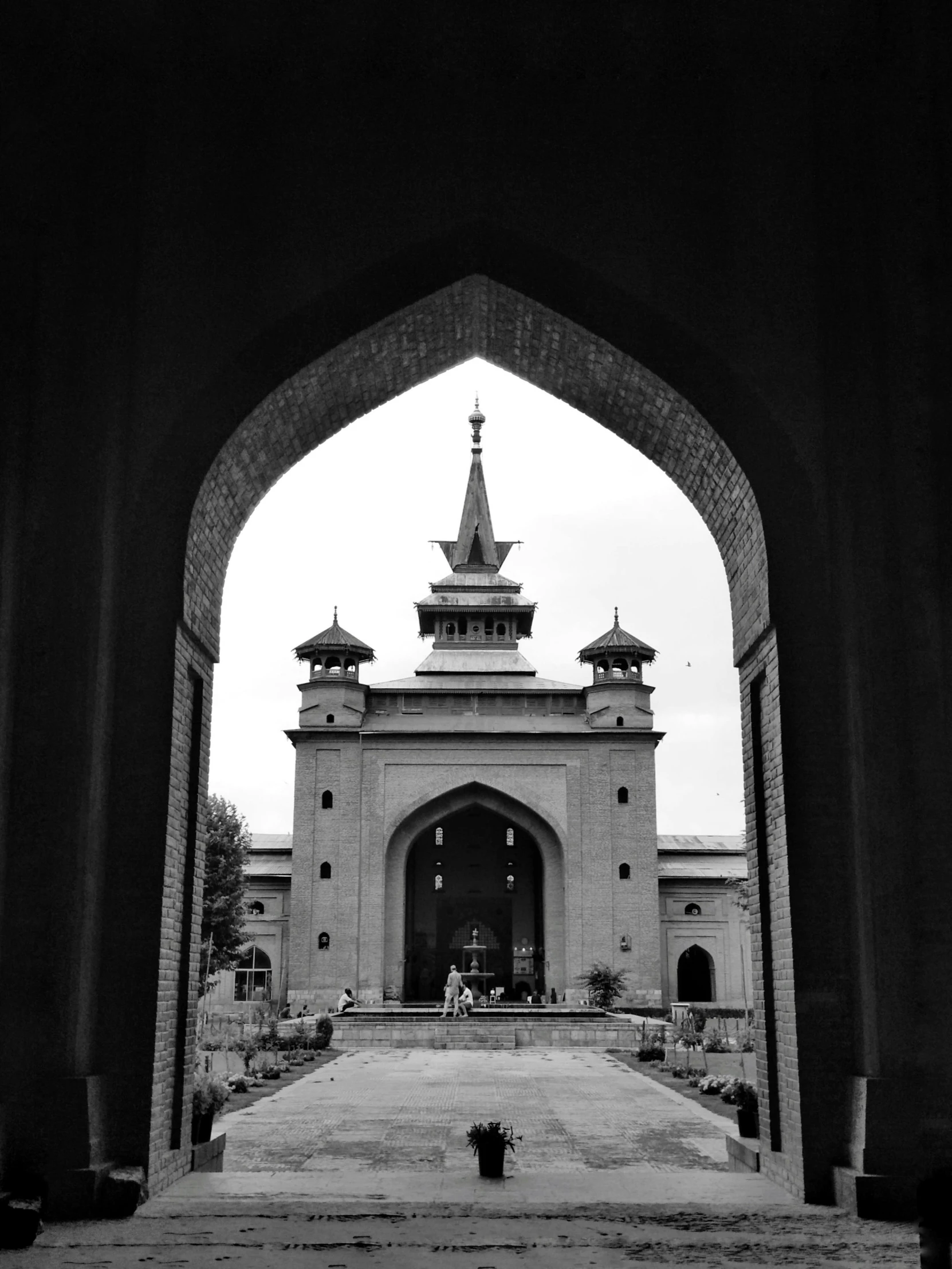 an entry to the complex with a clock tower in it