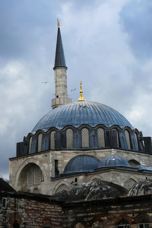 there is a large church building with blue roof