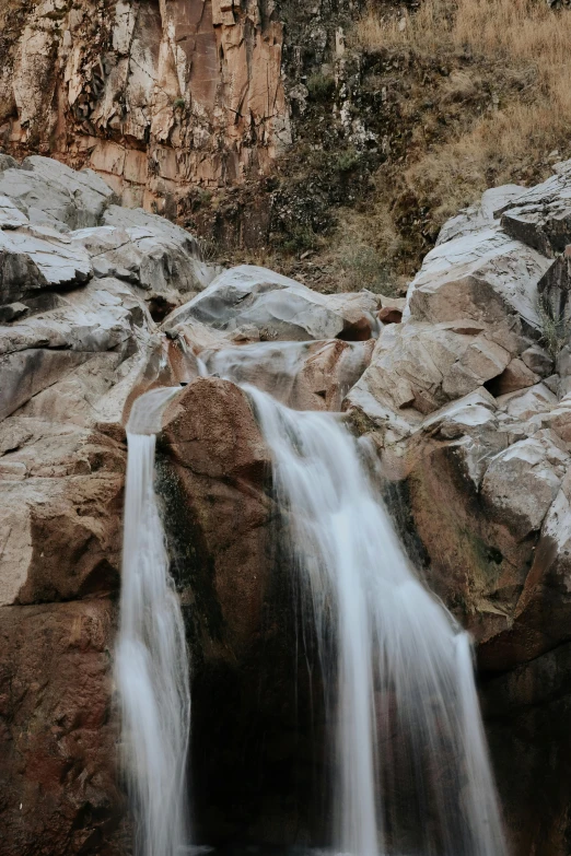 the waterfall is pouring into the water