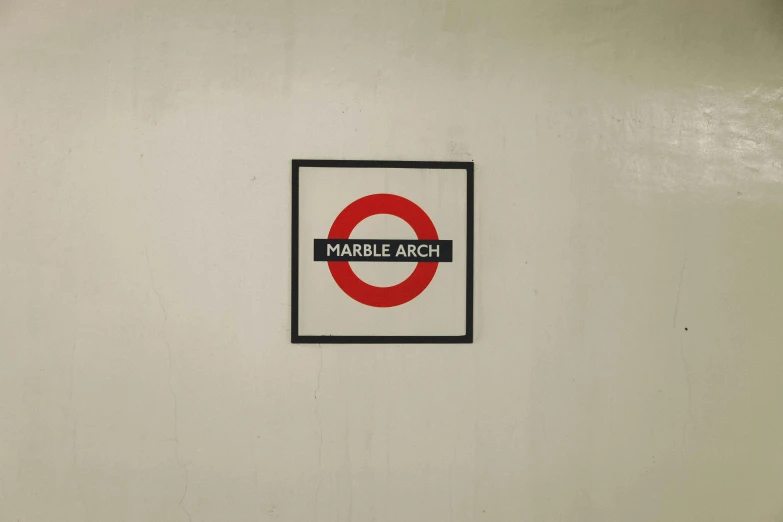 the logo for the marble arch is posted on the wall