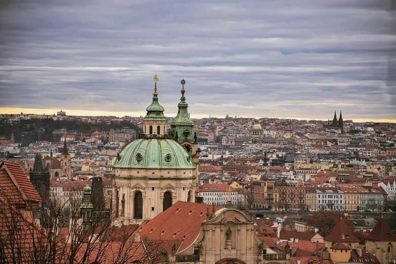 a large city has a green and white tower