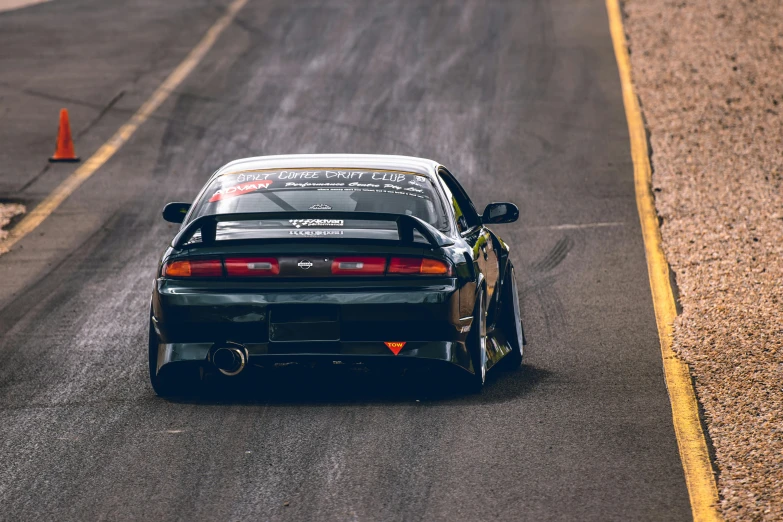 black car on a track, it is late to open the doors