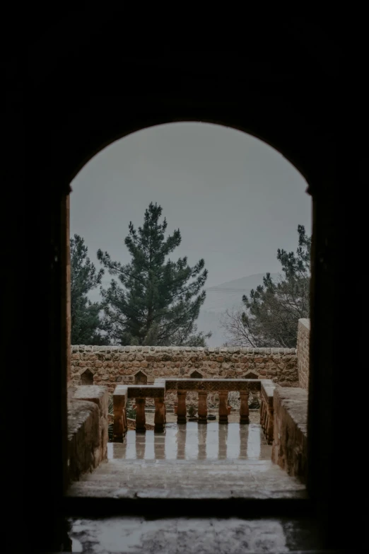 an arch in the wall between two pillars