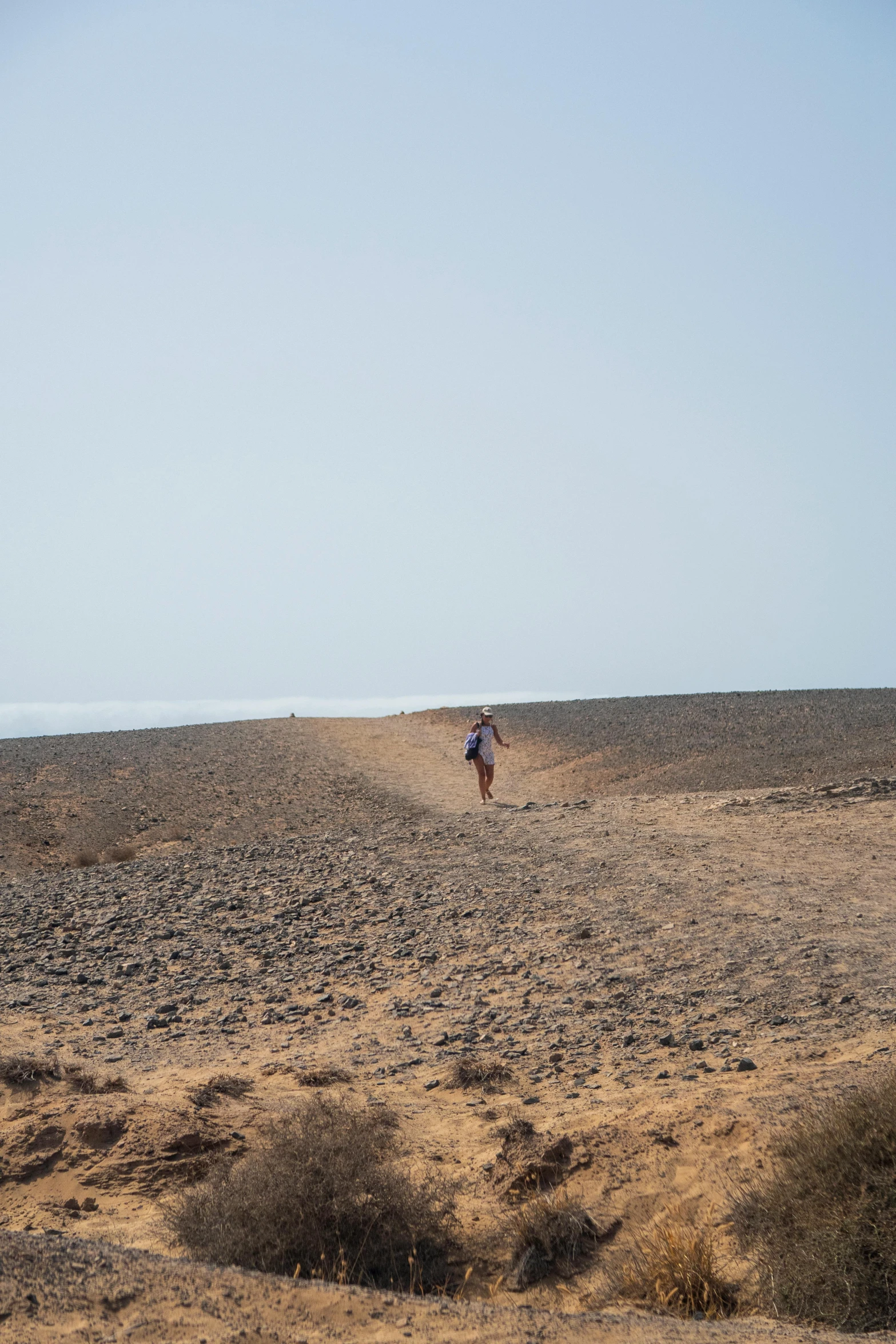 a man standing on top of a large field