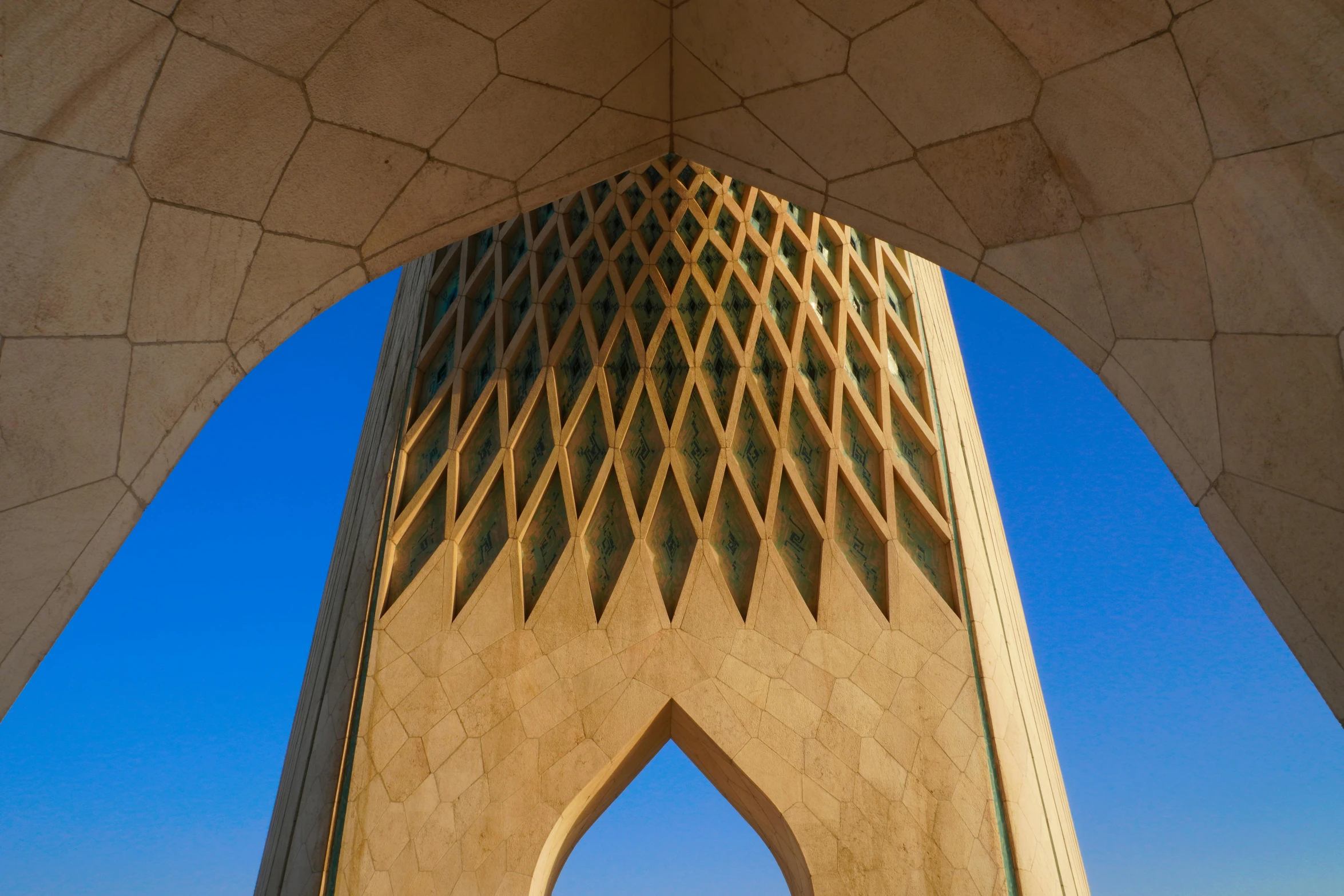 view from underneath and under a small arch in concrete