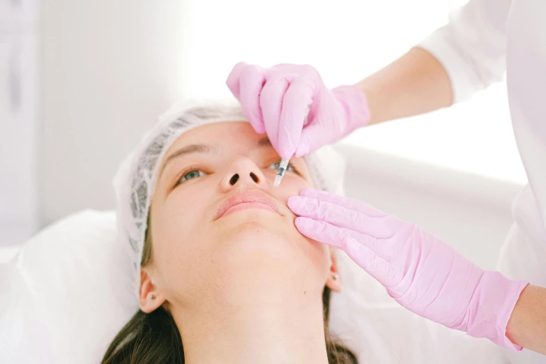 a woman having botula injection for her eye