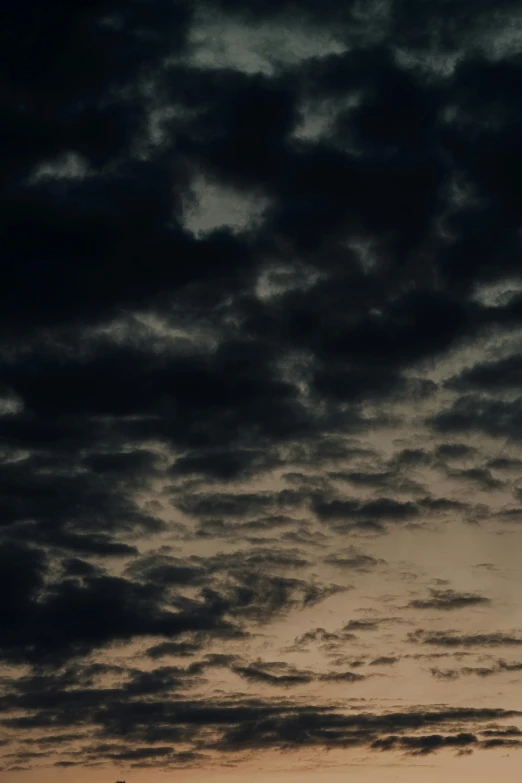 some plane flying up in the sky with clouds