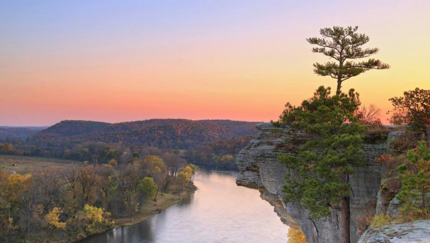 the sun sets on a beautiful fall day near the gorge