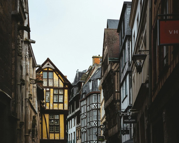 many buildings in the middle of a narrow city street